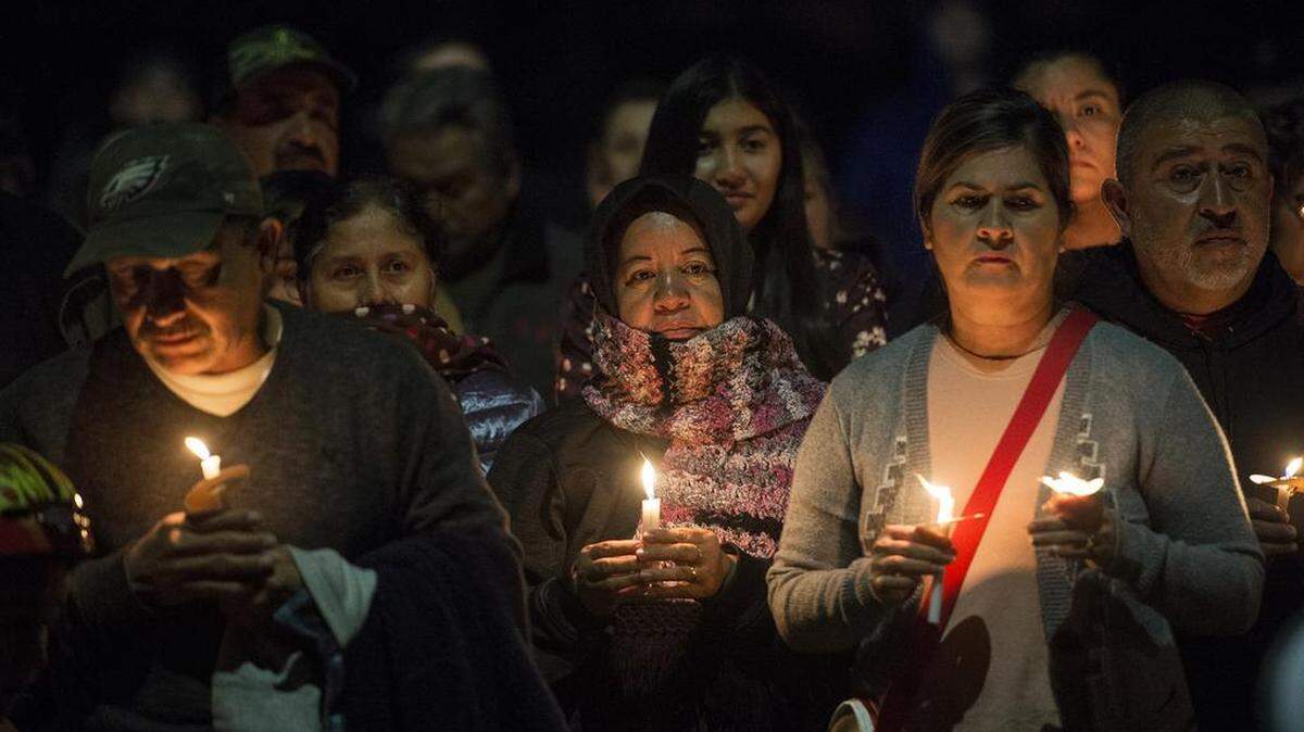 Le Grand High School's Restorative Justice League and community members gather for a candlelight vigil after three men were shot in front of a food truck at the intersection of Highway 140 and North Plainsburg Road in 2018.