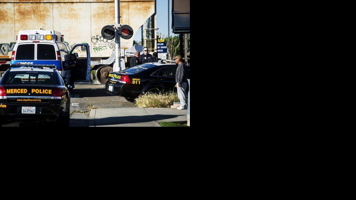 
Merced police respond to the scene after a man was struck and killed by a train on R Street between 15th and 16th Streets in Merced on Thursday. According to Merced police Sgt. Robert Solis, the man, who was walking southbound on R Street, continued to cross the train tracks after a witness warned him of the oncoming train.
