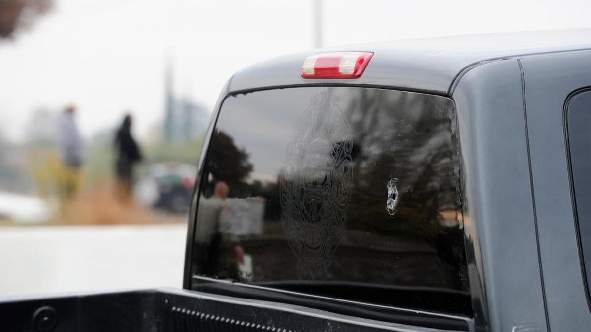 A bullet hole can be seen in the back window of a truck near the railroad tracks at Olive Avenue and Santa Fe Drive after an incident during a traffic stop in Winton on Thursday, Dec. 3, 2015.