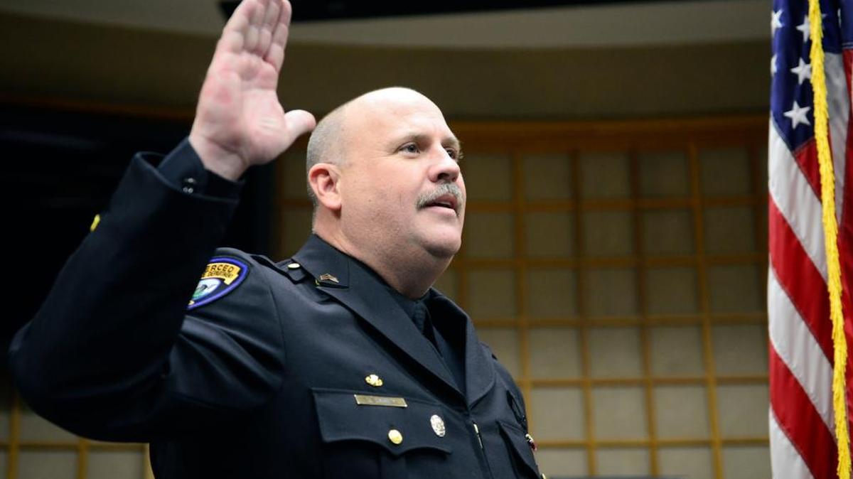 Dan Dabney, 44, recites his pledge to serve the city of Merced during a ceremony on Tuesday, Nov. 24, 2015, that promoted him to the rank of sergeant. He has worked for the Merced Police Department for 15 years, he said.