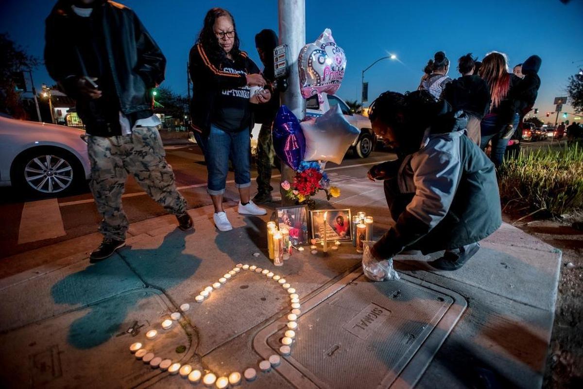 Candles are placed in the shape of a “D” during a candlelight vigil for 3-year-old Merced resident, Dayveonna Polk, near the intersection of R Street and 18th Street in Merced, Calif., on Tuesday, Dec. 5, 2017. Polk died at Valley Children’s Hospital on Tuesday, after suffering major injuries when she was struck by a hit-and-run driver in Merced on Monday, Dec. 4, 2017.