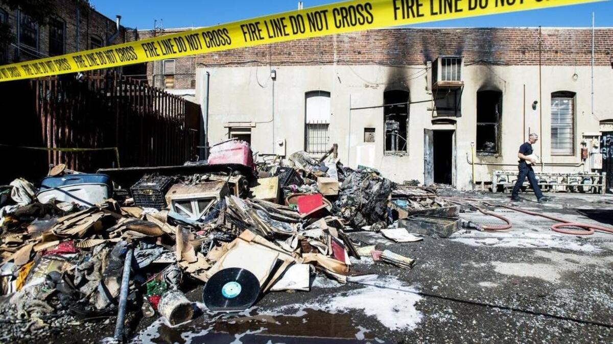 Merced City firefighters investigate the scene of an early morning fire at Bella Mijno Vintage, a thrift store, at 1720 Canal St. in Merced on Wednesday, March 30, 2016.