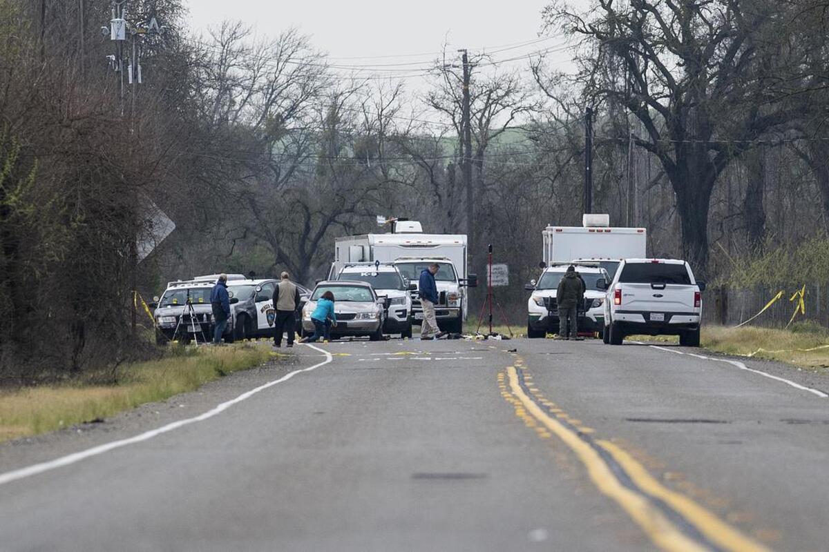 Law enforcement officers investigate a shooting on Snelling Road in Merced County on Friday. Kevin William Mayhew led authorities on a pursuit Thursday after Turlock police served a search warrant at his home. The chase ended in Snelling, where Mayhew began firing an assault-style weapon at officers, who returned fire, authorities said.