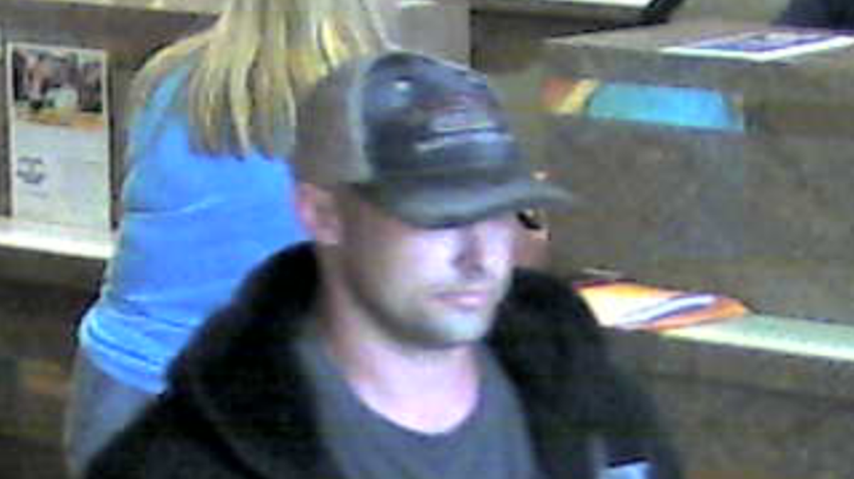 Investigators released an image captured by a security camera of the robbery suspect. The image shows a white male wearing a black zip-up hooded sweatshirt, a dark colored shirt and gray pants. He also is seen wearing a black baseball-style cap with a white-mesh back, according to deputies.