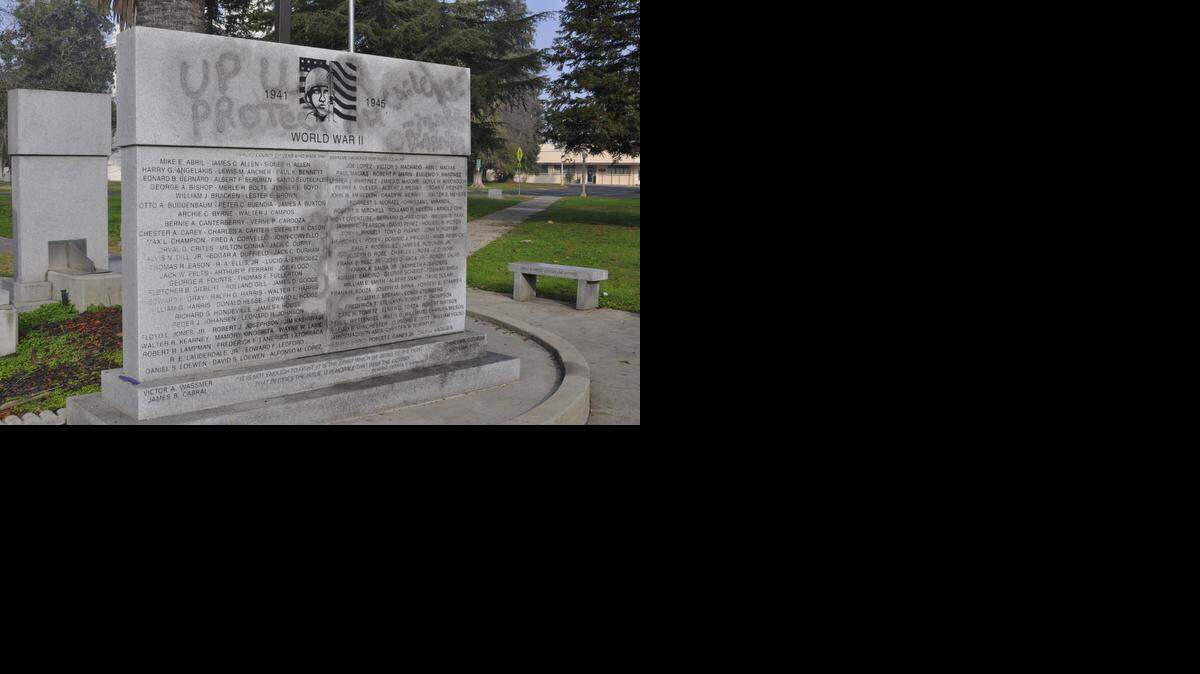 
The Merced County war memorial is seen after it was spray painted with graffiti. Volunteers tried to remove the black paint, but stains remain.
