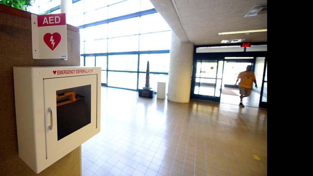 
A defibrillator is visible from the doorway at Merced City Hall on Thursday. The Merced Fire Department has set up five defibrillators around the city in hopes people will be ready to use them to help victims of a heart attack. They go along with a program the department started last year that uses an app to train users.

