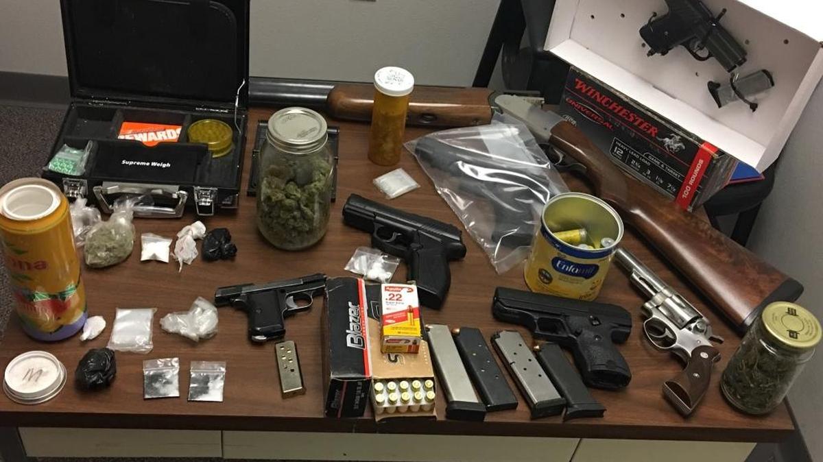 Two men were arrested early Tuesday in Atwater after police seized several firearms, drugs and an 11-month-old girl, whose crib was just feet away from a stash of methamphetamine, the Police Department reported.