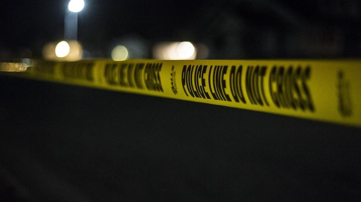 Merced Police place crime tape on I street in Merced, Calif., Saturday, Feb. 28, 2015.