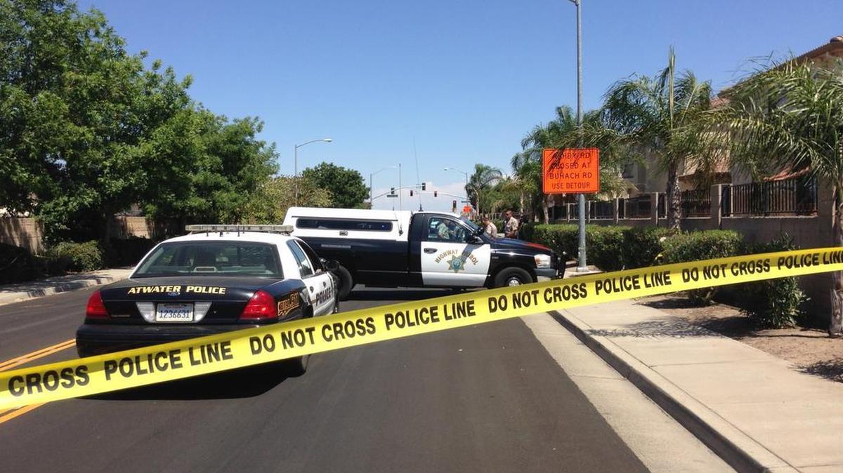 
Authorities respond to the scene after an Atwater police officer shot and killed a man suspected in a domestic-violence-related kidnapping on July 6 near Green Sands Avenue in Atwater.
