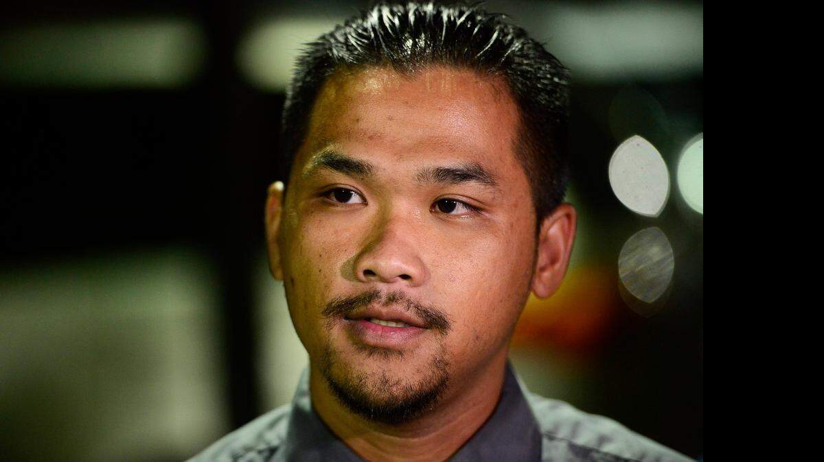 
Jonathan Thao, 23, of Merced, speaks with media about the death of three-year-old Santos Alvarez during a candlelight vigil held in the child's honor at McDonald's restaurant located at 1060 W. 13th St. in Merced, Calif., Thursday, Nov. 6, 2014. According to authorities, Alvarez was reportedly killed after he was struck by a car on Monday, Nov. 3, 2014.
