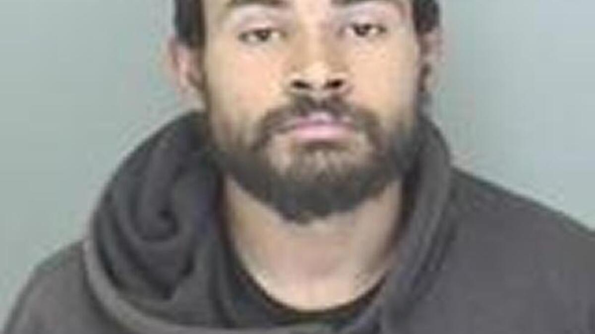 Lamont V. Johnson, 29, is accused of biting one police officer and also kicking a police dog in the head and trying to take a police officer’s gun.