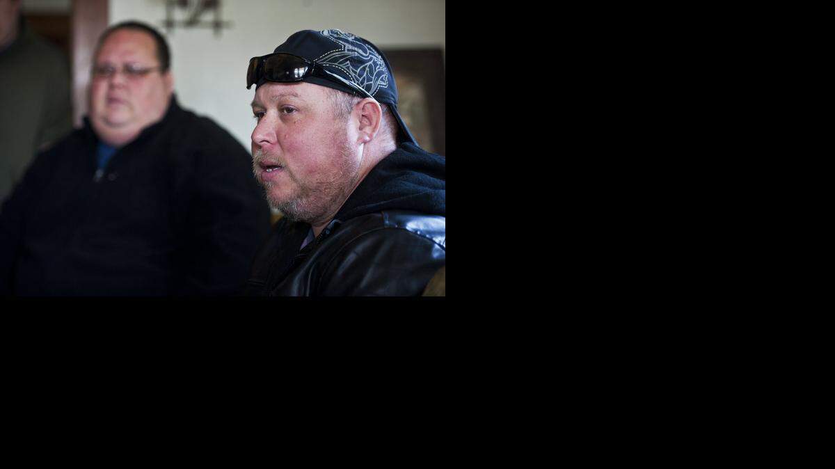 
David Barker, 38, of Ceres, speaks about his father, Dean Barker, with brothers Michael Barker, 36, Joshua Barker, 31, and Tim Barker, 32, in Merced on Tuesday. Dean Barker, 59, a driver for Merced Taxicab Co. and former Dos Palos police officer, was shot just after midnight Monday in his taxicab on Mimi Lane. 
