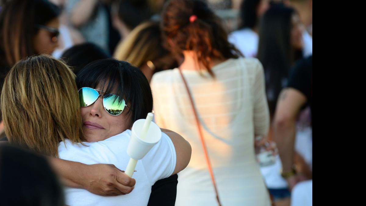 
Monica Saucedo of Merced hugs visitors at a candlelight vigil Thursday for her daughter, Desirae Crittenden, 19, who was killed Sunday near California State University, Northridge, when her car was struck by a suspected drunken driver. About 200 people gathered in a park in north Merced to remember her and share stories.
