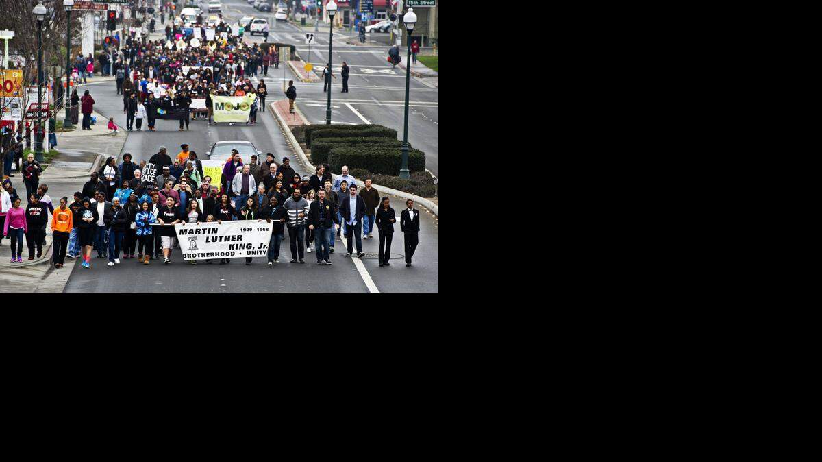 
Participants march during the 2015 Martin Luther King Parade along Martin Luther King Jr. Way in Merced, Calif., Monday, Jan. 19, 2015.
