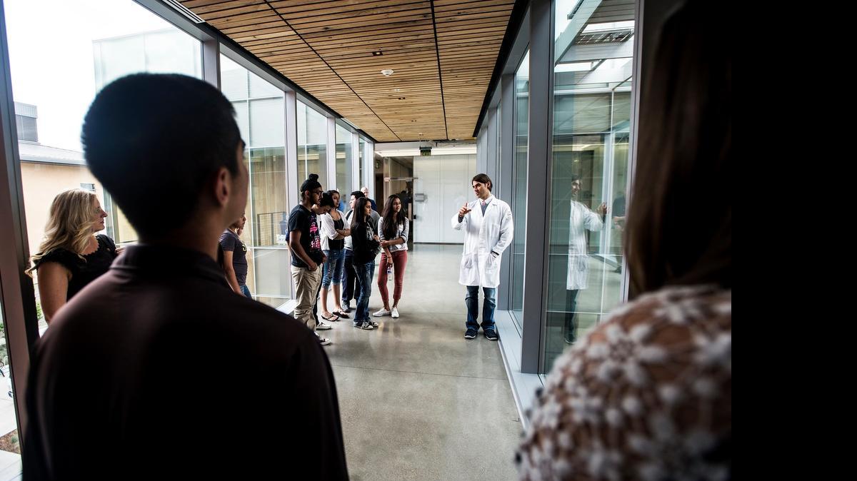 
Fabian Filipp, assistant professor of systems biology at UC Merced, gives Buhach Colony High School students a tour of the new Science and Engineering Building 2 after a lecture on his recent melanoma study last month. About $1.8 million from the state is set to connect Merced County students with area higher education programs.
