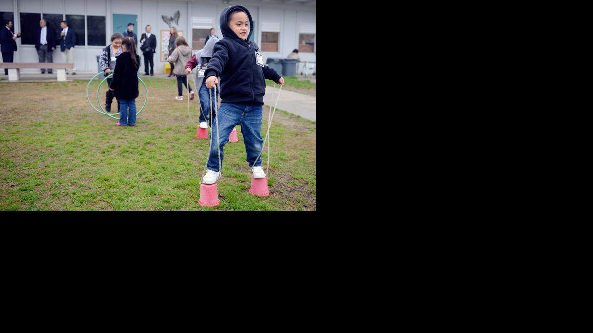 
Nathan Noriega-Chavez, 4, of Merced tries to balance on stilts during recess on Friday at the Fairside Head Start in Merced, where Rep. Jim Costa, D-Fresno, announced that more than $1 million has been awarded to the Merced County Office of Education. The money will begin an Early Head Start program in Planada. 

