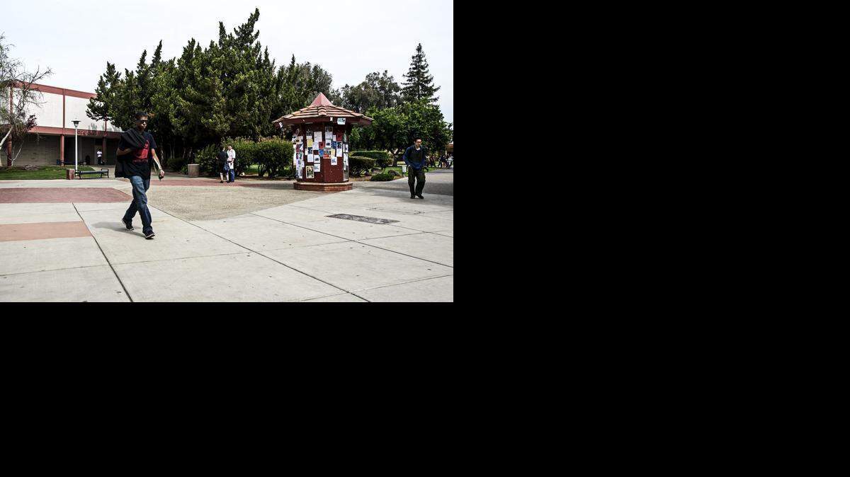 
Students walk through the Merced College quad on Friday. A Merced College group called Students for Liberty is attempting to expand the free speech zone.
