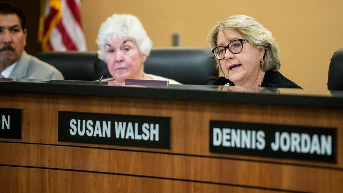 Acting Merced College President Susan Walsh has denied attempting to have a board member arrested.