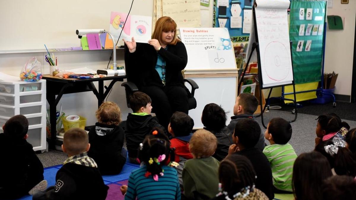 Jill Roberts, a transitional kindergarten teacher, reads to her class at Rivera Elementary on Monday. The elementary school opened last fall.