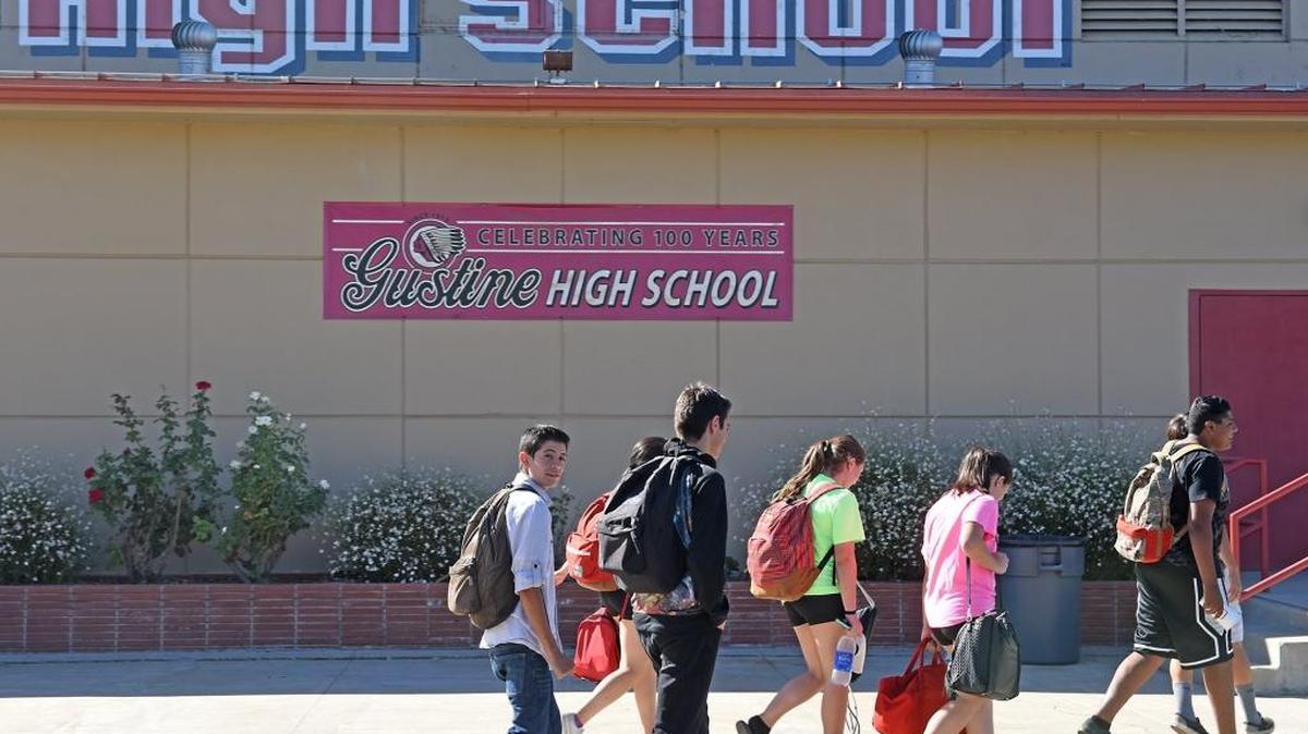 
Students pass by the gym on Monday at the Gustine High School campus in Gustine.

