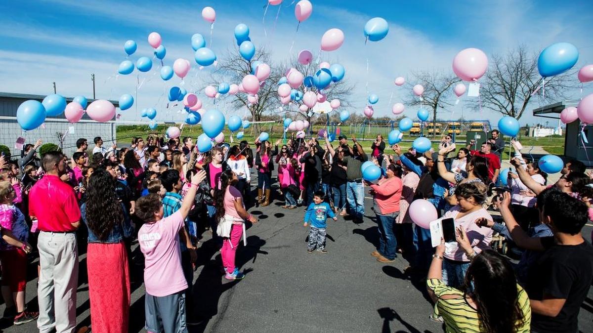 Washington Elementary School students and staff release balloons containing messages into the sky during a memorial ceremony for Nayeli and Jonathan Hernandez at Washington Elementary School in Winton on Friday, Feb. 19, 2016.