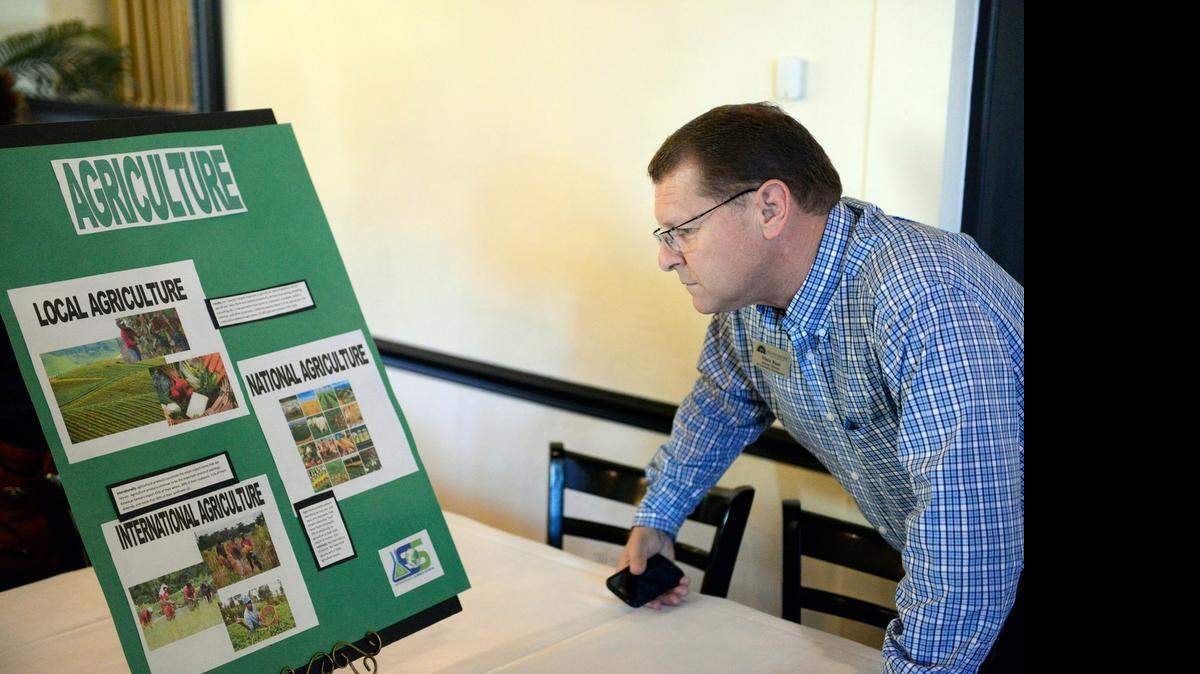 
Vince Roos, assistant director for community development at Merced Center, an extension of Fresno Pacific University, checks out a display Friday of plans for a hands-on science museum in Merced.
