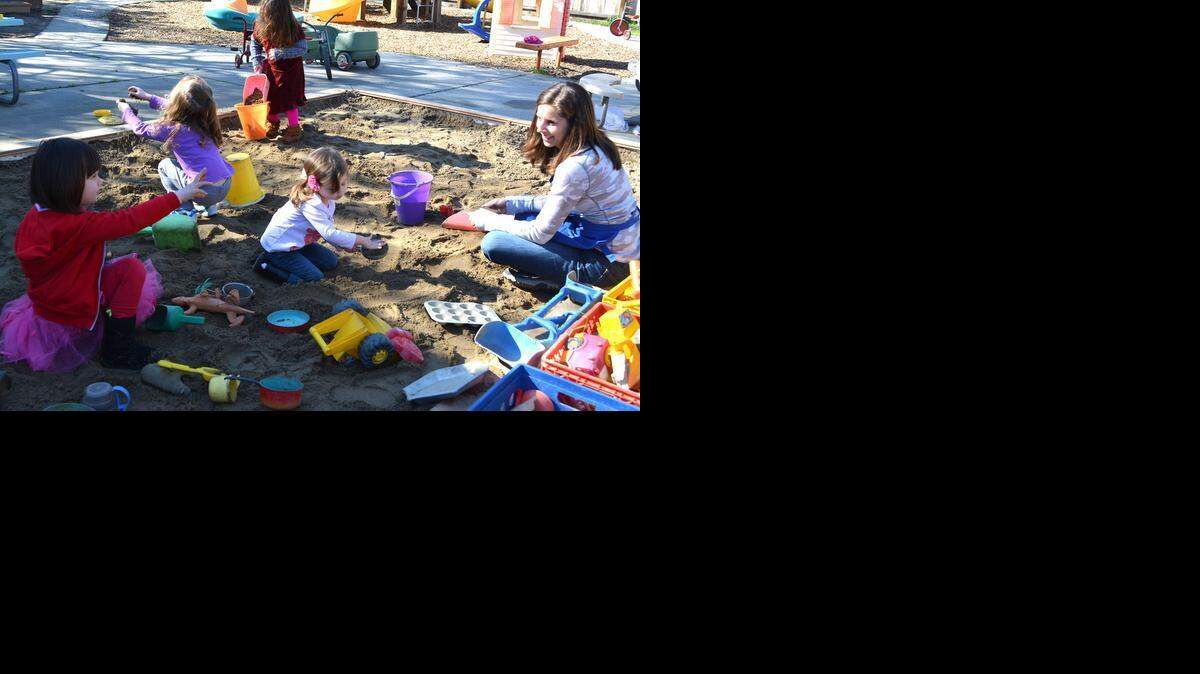 
Teacher Angela Slack encourages sand play at Modesto Parent Participation Preschool. The school relies on parent volunteers to keep the child-to-adult ratio low.
