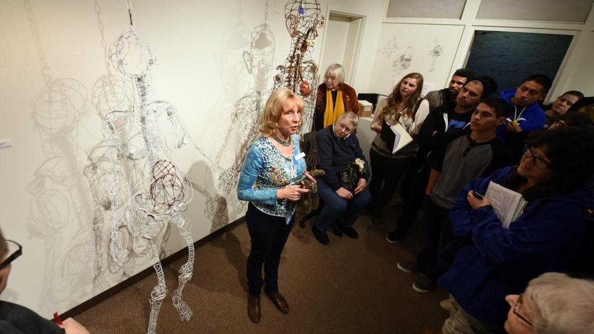 Wendy Ballen, 61, an artist from Santa Cruz, speaks to a room full of students about her wire sculpture art at the Merced College Gallery on Wednesday. The “Wired and Twisted” show is set to stay up through Feb. 11.