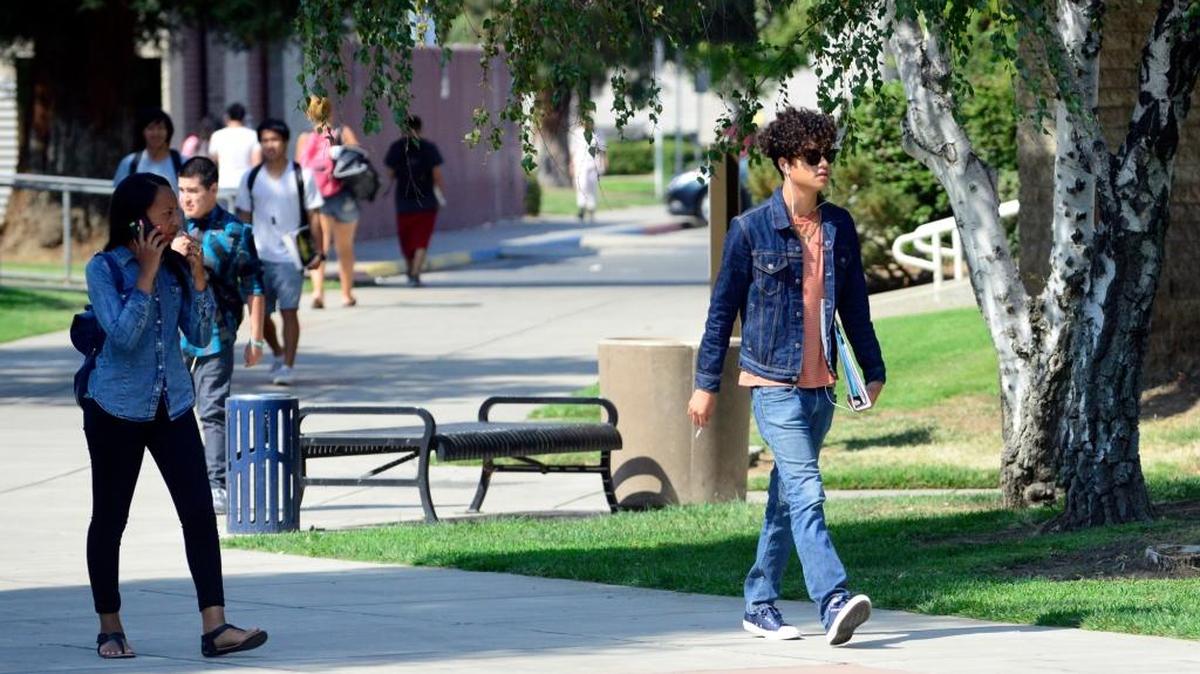 
Students walk through the quad near the Lesher Student Services building at Merced College on Thursday. Officials said enrollment through last week was up by about 2.85 percent from the same time last year.
