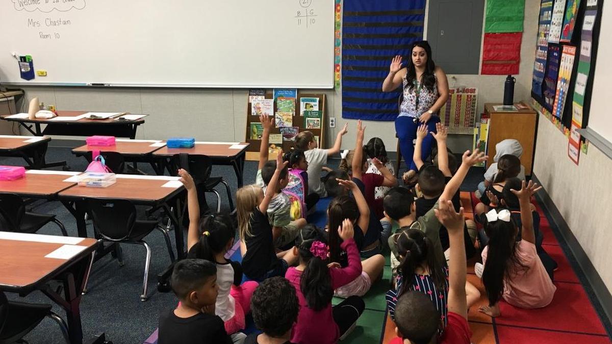 Fremont Elementary teacher Nicole Chastain talks to students about how they’re feeling on the first day of school.
