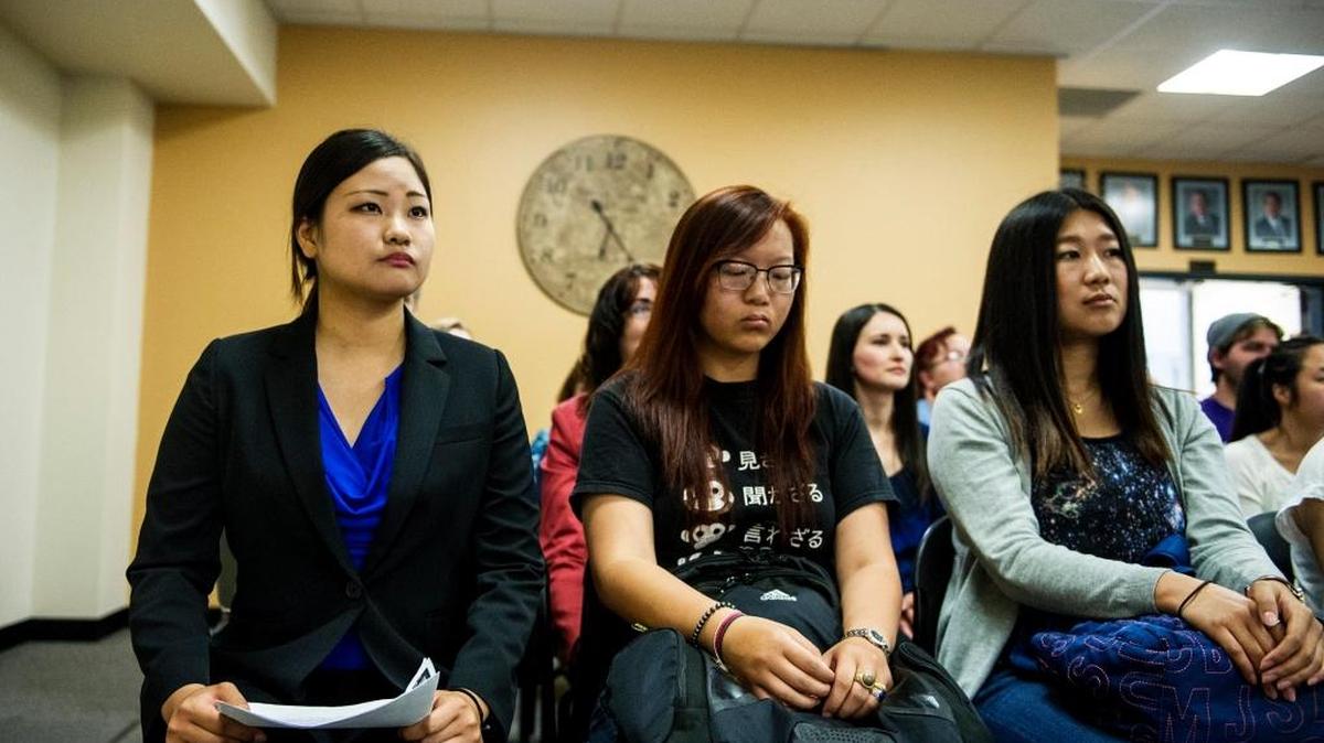Merced College student Izumi Ota, 21, left, prepares to speak to Merced College board members during a meeting Tuesday at Merced College. Ota spoke on behalf of Japanese exchange students who feel their host families through the Your English Services or YES program are not living up to their contractual obligations.