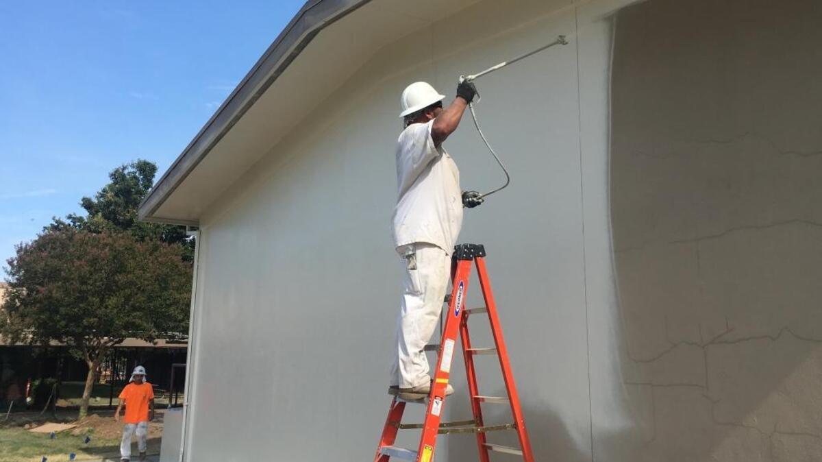 Fremont Elementary receives a fresh coat paint as part of a modernization and improvement project underway this summer.