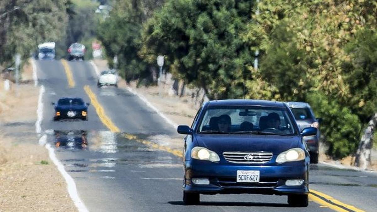 Motorists drive along North Lake Road in Merced on Wednesday, Oct. 21, 2015. UC Merced has come to an agreement with the city of Merced to widen North Lake Road and Bellevue Road as the university grows.