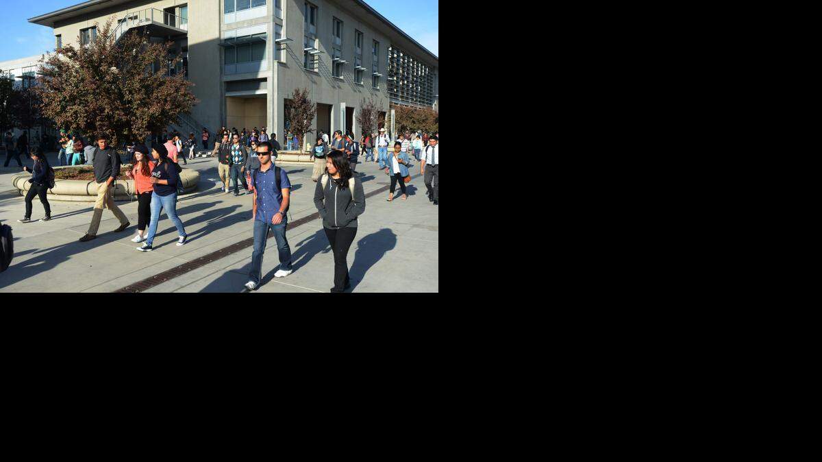 
Students walk along UC Merced’s Scholars Lane in 2013. An independent policy and research center recognized UC Merced this month, citing ongoing programs as examples of university’s efforts to connect with the region and the city for which it’s named. 

