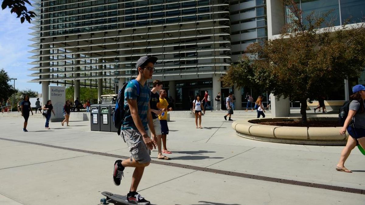 
Students travel near the Kolligian Library at UC Merced on Thursday. The school reported its largest ever enrollment the same day.
