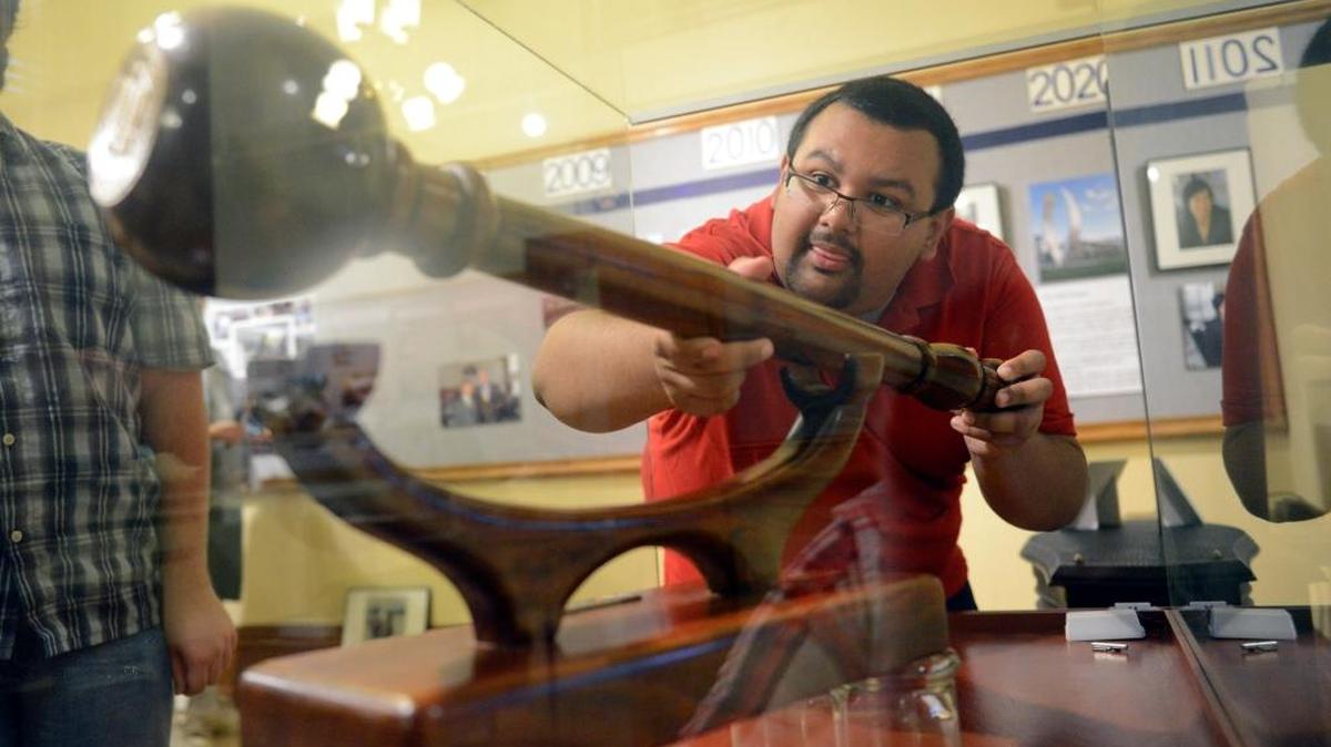
Ramon Barragan, 21, a history student, and other UC Merced interns and volunteers set up displays on Friday, Oct. 9, 2015, for Merced County Courthouse’s newest exhibit, “UC Merced at 10: A Decade of Building, Developing and Contributing to our Community.”
