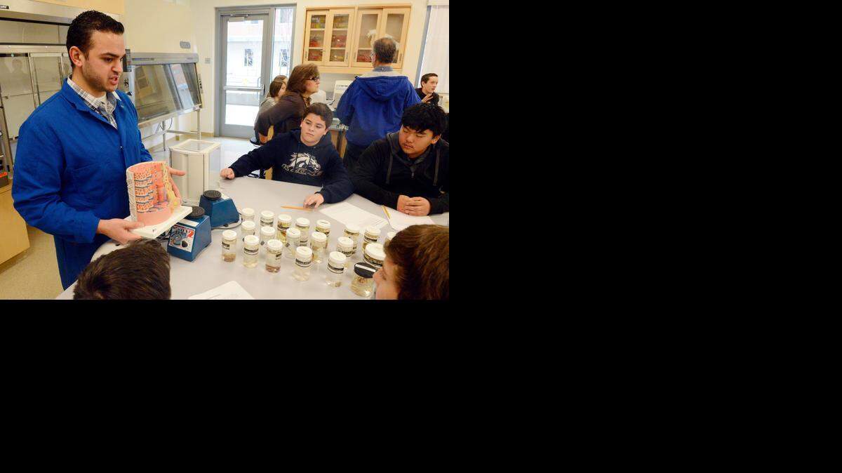 
Paul Barghouth, 24, a doctoral student at UC Merced, teaches students from the McSwain Elementary School about muscle tissue fibers in a UC Merced laboratory on Wednesday during an educational event organized by science program From Quanta to Quasars. The educational effort has spread to six classrooms in five Merced-area schools.
