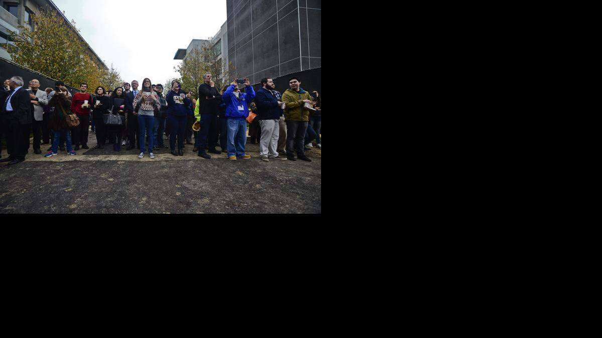 
Students and faculty look on during the “topping” ceremony for UC Merced’s new Classroom and Office Building 2 on Tuesday. The more than 77,000 square foot building is scheduled to open in April 2016. It will house classrooms, tutorial space, academic and administrative offices as well as a research lab.
