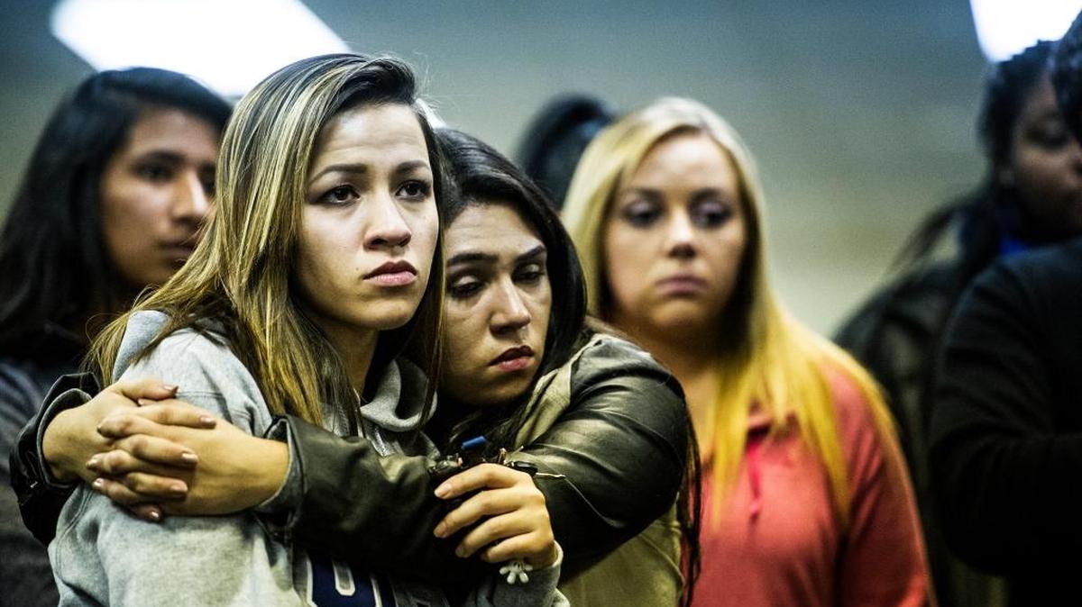 UC Merced junior Vanessa Dias, 20, of Tracy, left, is hugged by Maria Higareda-Marquez, 20, of Merced, right, during a gathering at Vault Works in downtown Merced on Wednesday, Nov. 4, 2015. Students held the gathering in a show of support for one another after a man stabbed four people on the UC Merced campus before being shot and killed by campus police Wednesday morning.