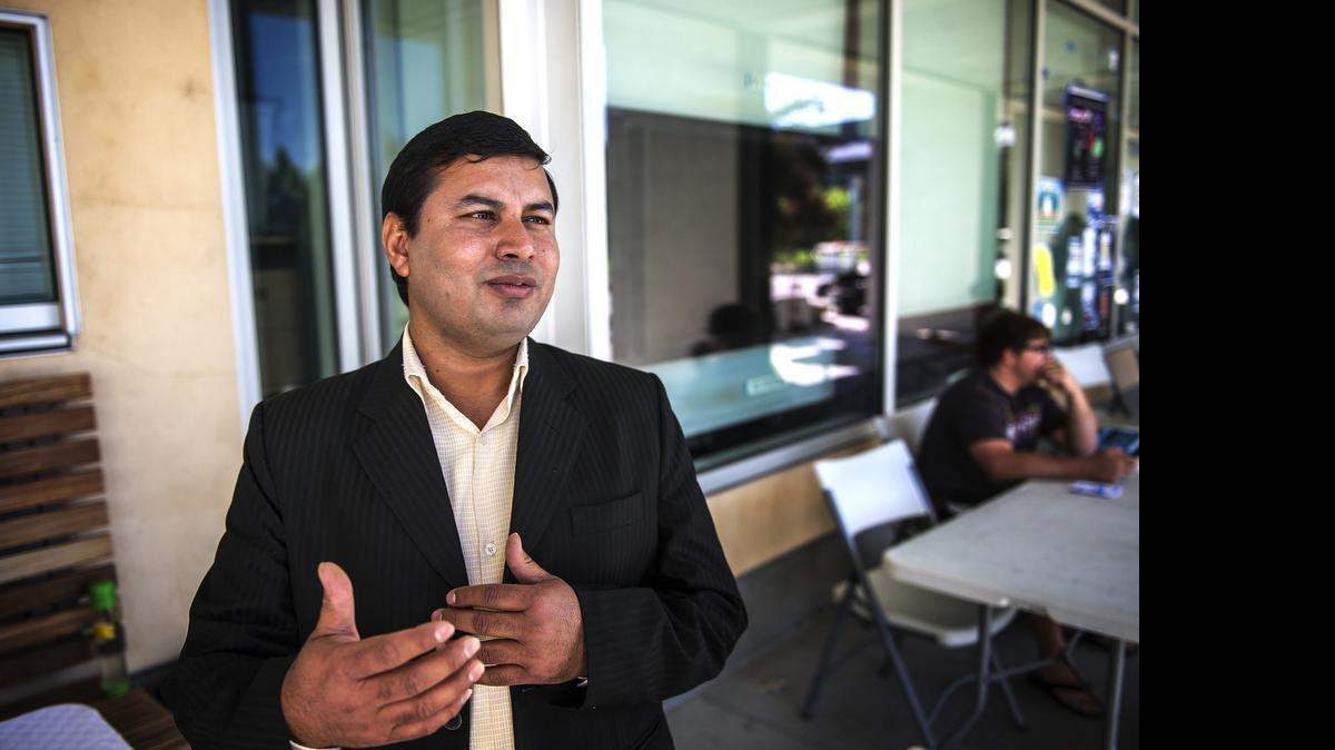 
Jiba Dahal, 31, a doctoral student at UC Merced, raises money on campus Wednesday for his home country, Nepal, following a magnitude-7.8 earthquake there Saturday.
