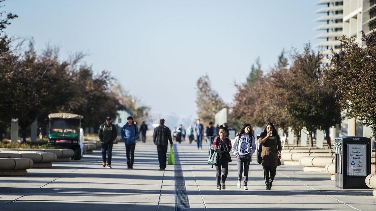 Students walk along Scholars Lane on the UC Merced campus Nov. 6. Two University of California Board of Regents committees approved plans for the next phase of growth at UC Merced, what officials say clears the way for approval by the board on Friday.