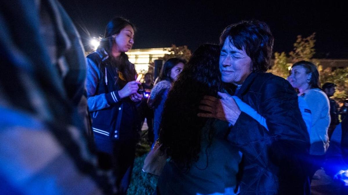 University of California, Merced Chancellor Dorothy Leland hugs students following a vigil at the University of California, Merced in Merced, Calif., Friday, Nov. 6, 2015. Students and staff walked from the campus' South Bowl across the Scholars Lane Bridge toward the Carol Tomlinson-Keasy Quad, in an effort to reclaim the bridge following Wednesday's stabbing spree which left four people wounded and the suspected stabber dead after being shot by the UC Merced police.