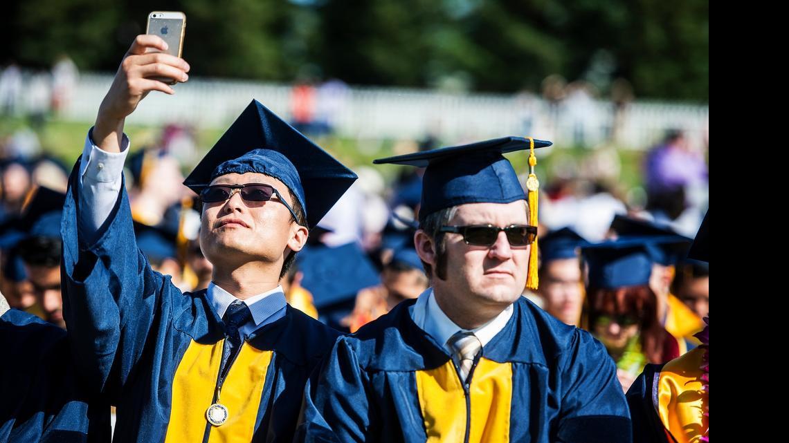 
Graduate Tao Ren, 29, of China, takes a selfie during the University of California, Merced commencement ceremony for the School of Engineering and the School of Natural Sciences, in the university's South Bowl, in Merced, Calif., Saturday. Over 500 graduates received degrees.
