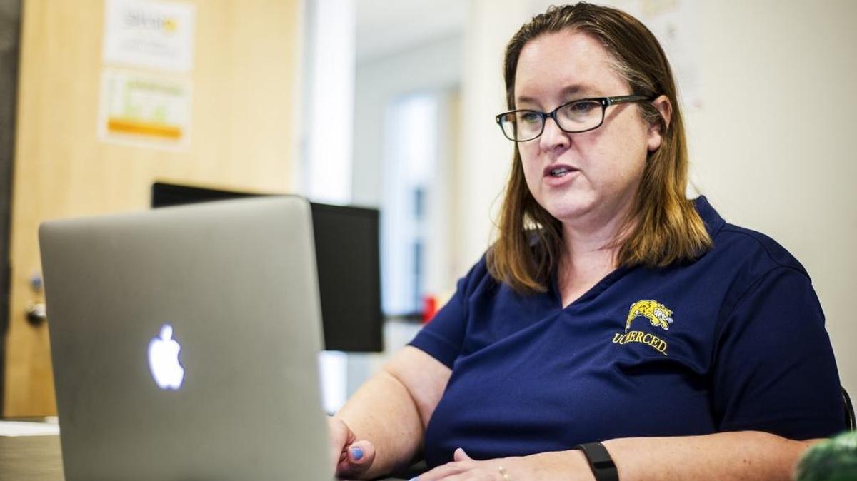 
Erin Mutch, manager of the  UC Merced Spatial Analysis and Research Center, speaks Monday about an interactive Butte fire map showing the fire’s movement compared to previous wildfires in the region.
