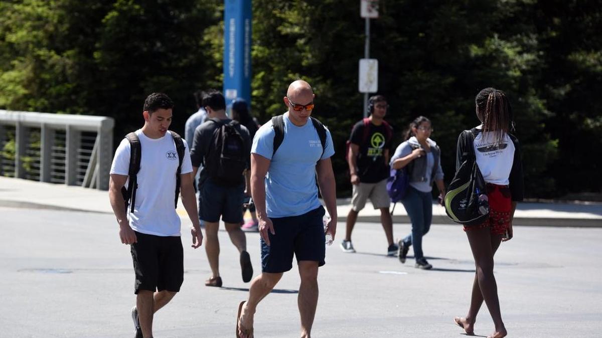Students travel on the UC Merced campus on Monday, April 4, 2016. The University of California increased the numbers of California residents and minority students it admitted for next year, officials reported Monday.