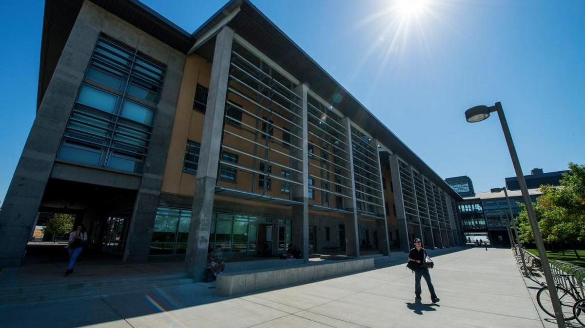 Students walk past the Science and Engineering Building on the University of California, Merced, campus Tuesday, Sept. 6, 2016.