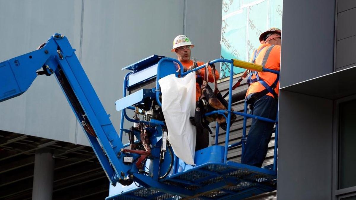 A construction crew works on Classroom and Office Building 2 in January at UC Merced, which received a record number of applications for the fall semester, officials reported. The school got 22,632 applications, 13.5 percent more than last fall.