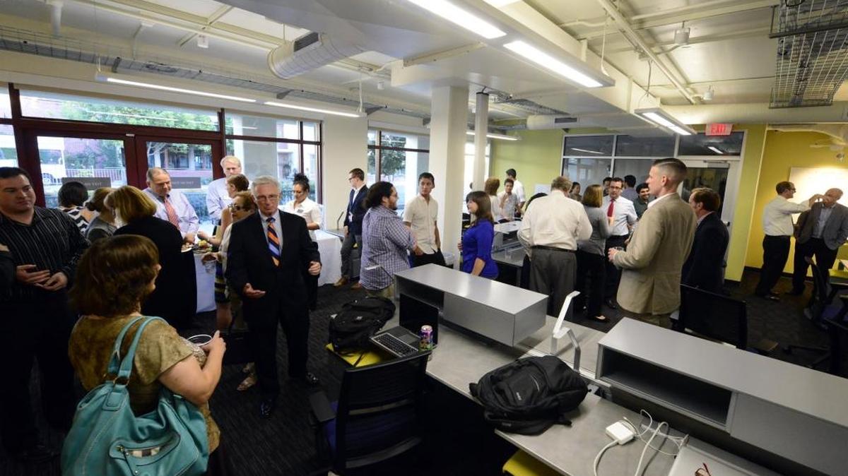 
Members of the Merced City Council and others mingle with students and check out the UC Merced Venture Lab, a business incubator, last month. University officials plan a ceremony and chance to tour the lab at 2:30 p.m. Oct. 15 at the 1735 N. M St. lab.
