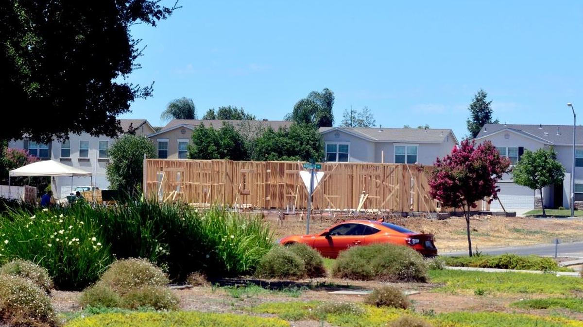 A new apartment building is rising from the ground on Compass Pointe Avenue and Pacific Drive in north Merced, to accommodate an influx of college students, on Thursday, July 21, 2016, in Merced.