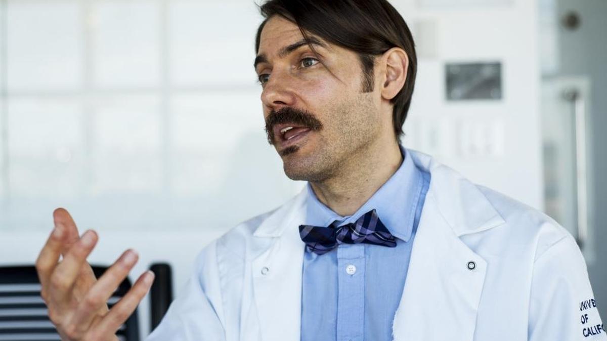 UC Merced professor of systems biology and cancer metabolism, Fabian Filipp, speaks about his research inside Science and Engineering Building 2 on the campus on Thursday. Filipp is working to develop precision targeting of cancer cells for personalized medicine.